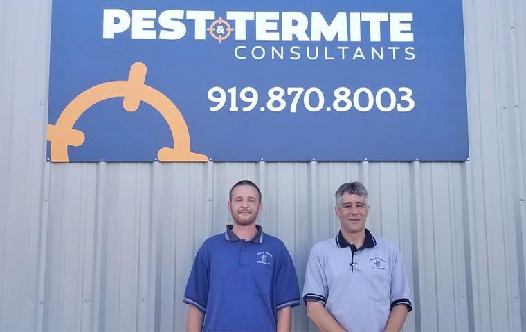 Pest & Termite Consultants staff and sign